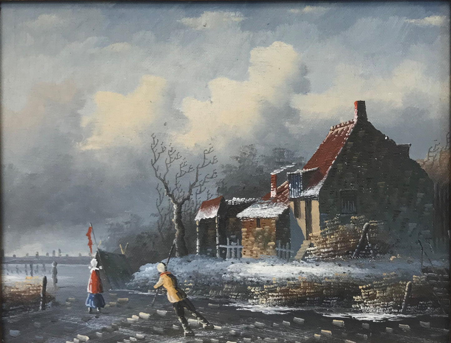 Patineurs sur glace près d'un chalet