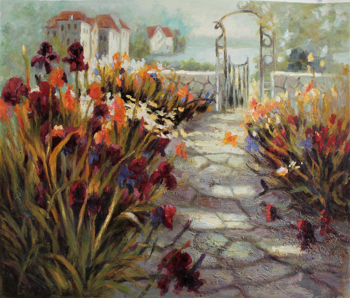 Garden pathway surrounded by lilies and orchids