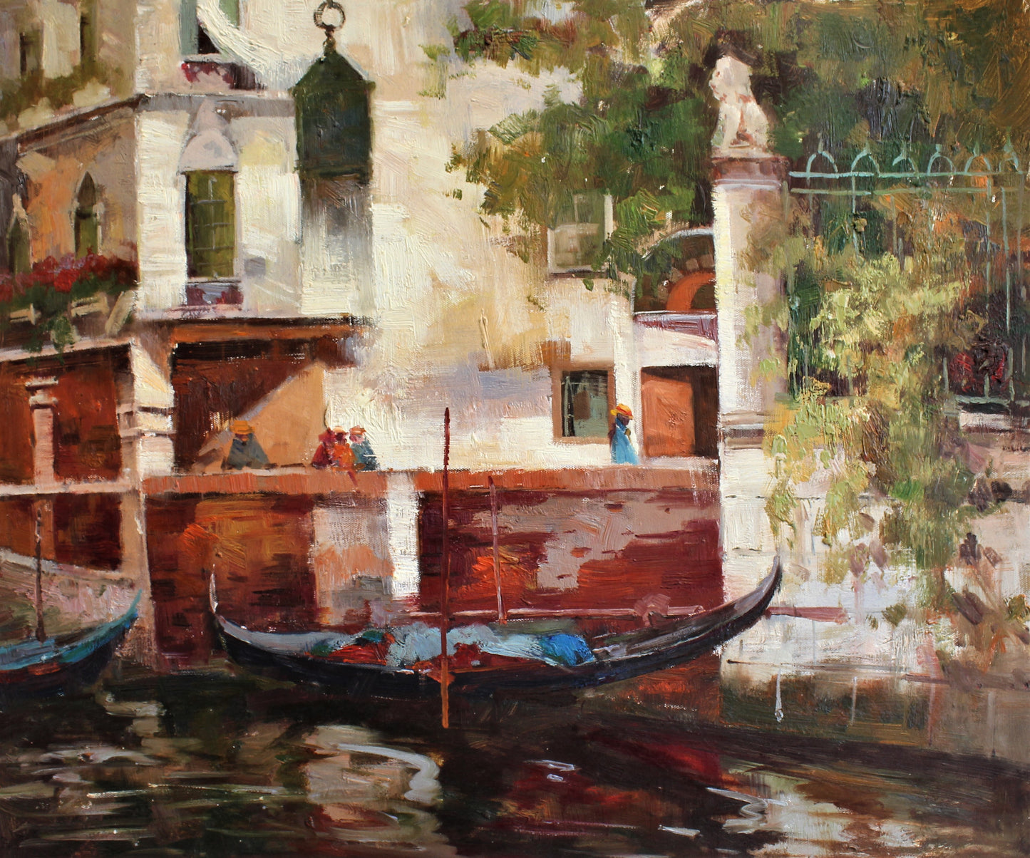 Boats on the edge of a canal next to buildings