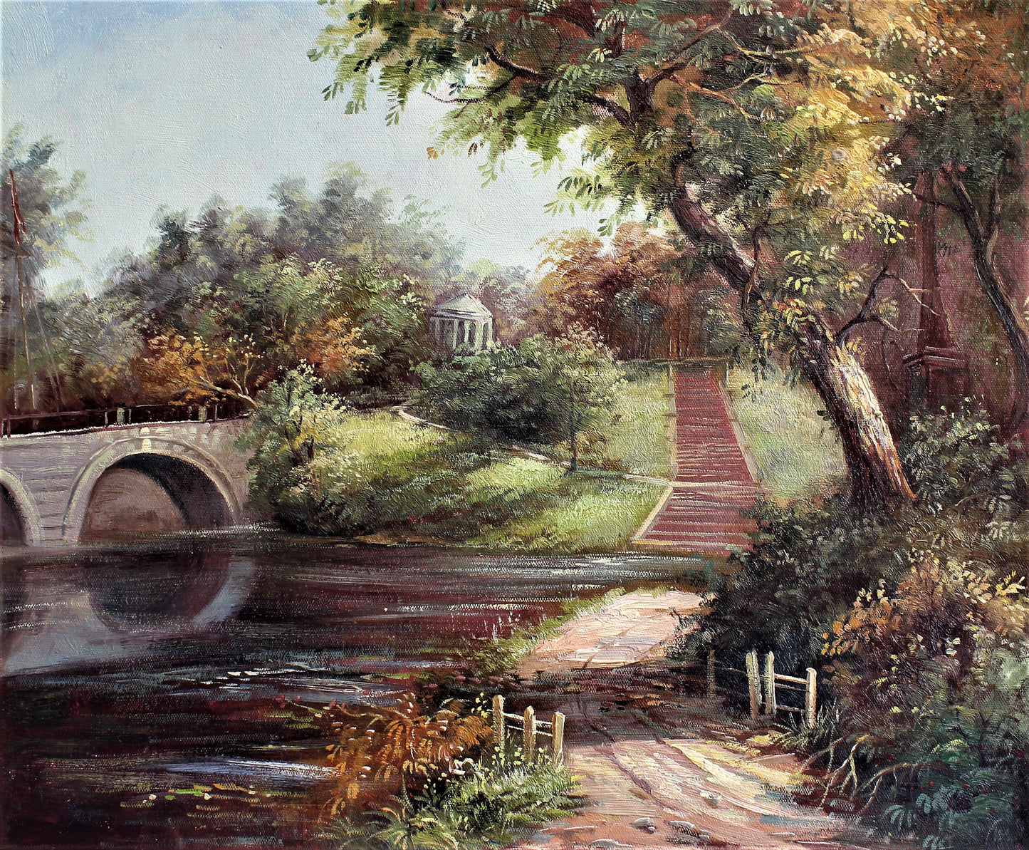 Road next to a pond and a bridge