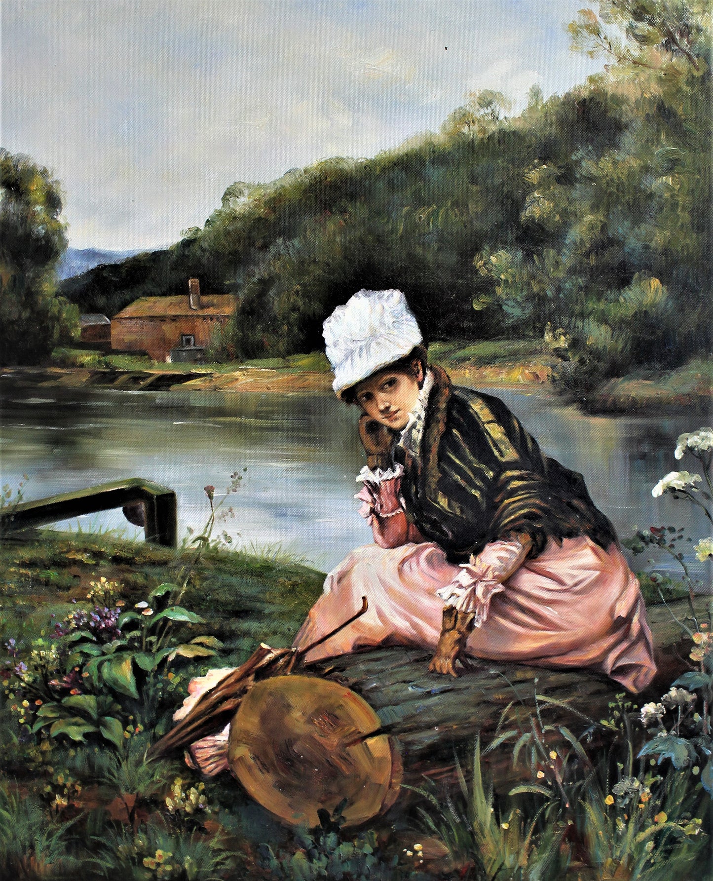 Femme assise au bord de la rivière