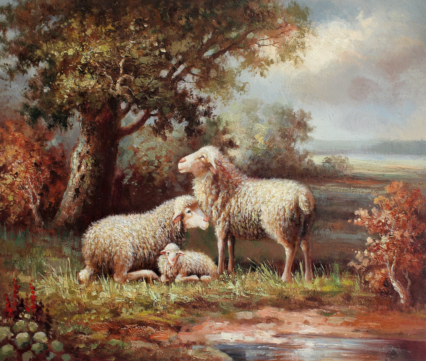 Deux moutons et un agneau dans un pré