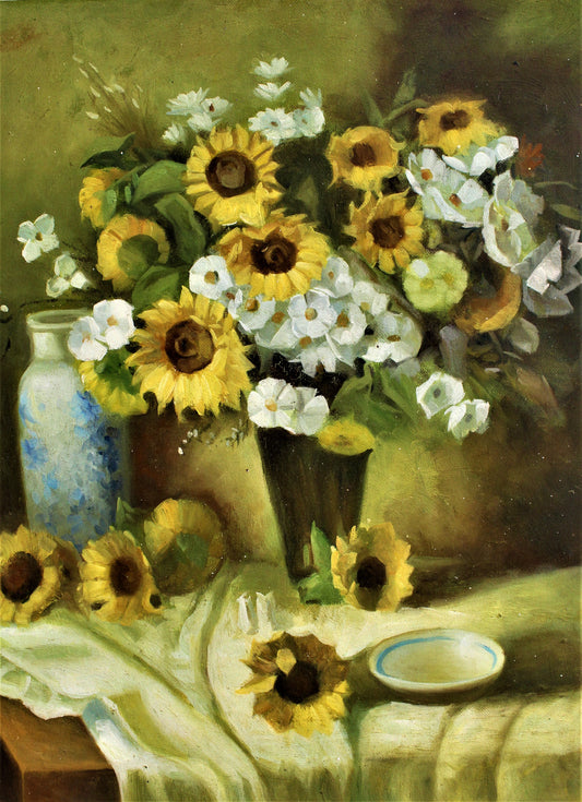 Sunflowers and white flowers in a vase