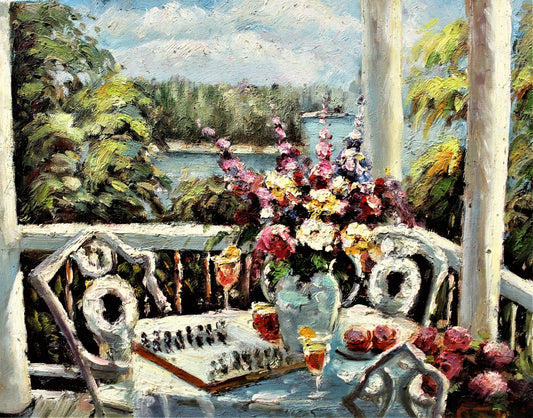 Chess game on balcony table with flowers