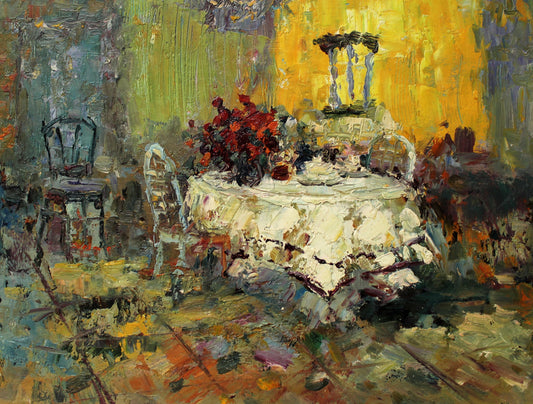 Dining table with bouquet of red flowers