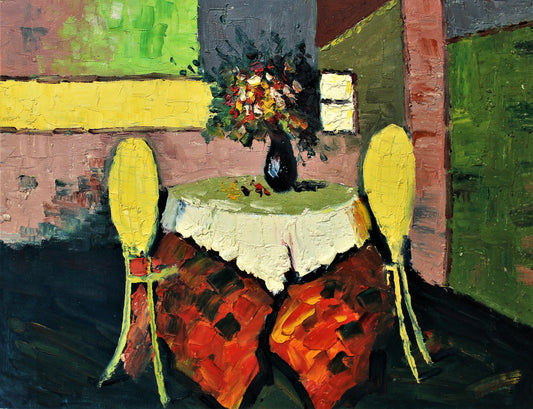 Table with two yellow chairs and flowers