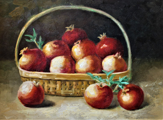 Still life of pomegranates in a basket