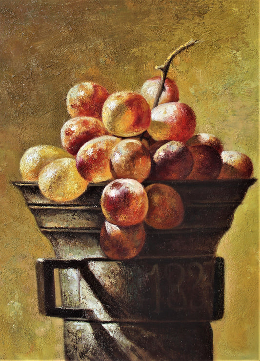 Still life of grapes in a unique metal container