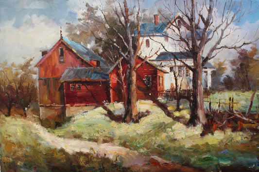 Maison rouge et blanche avec des arbres nus