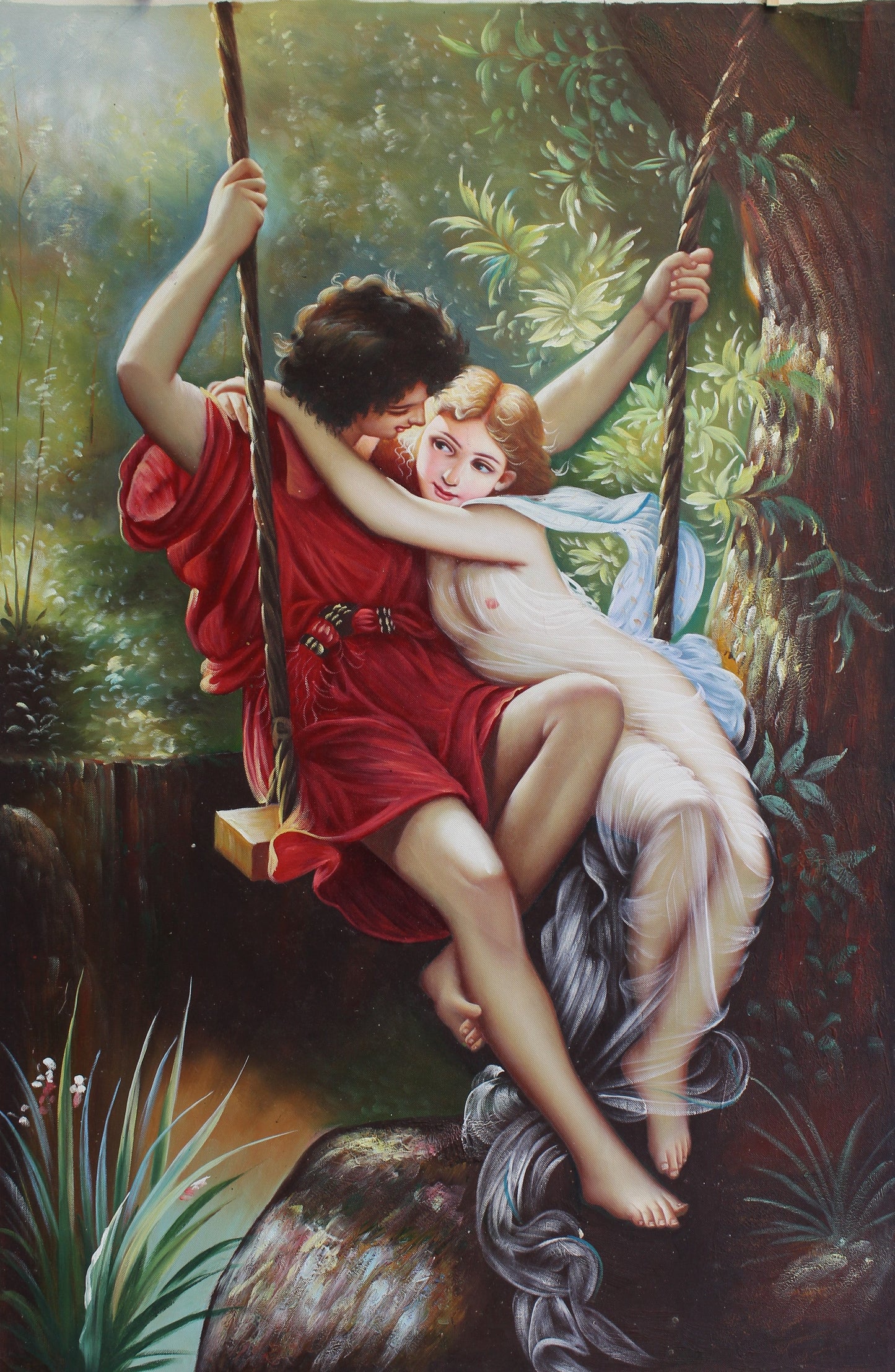 Jeune couple sur une balançoire
