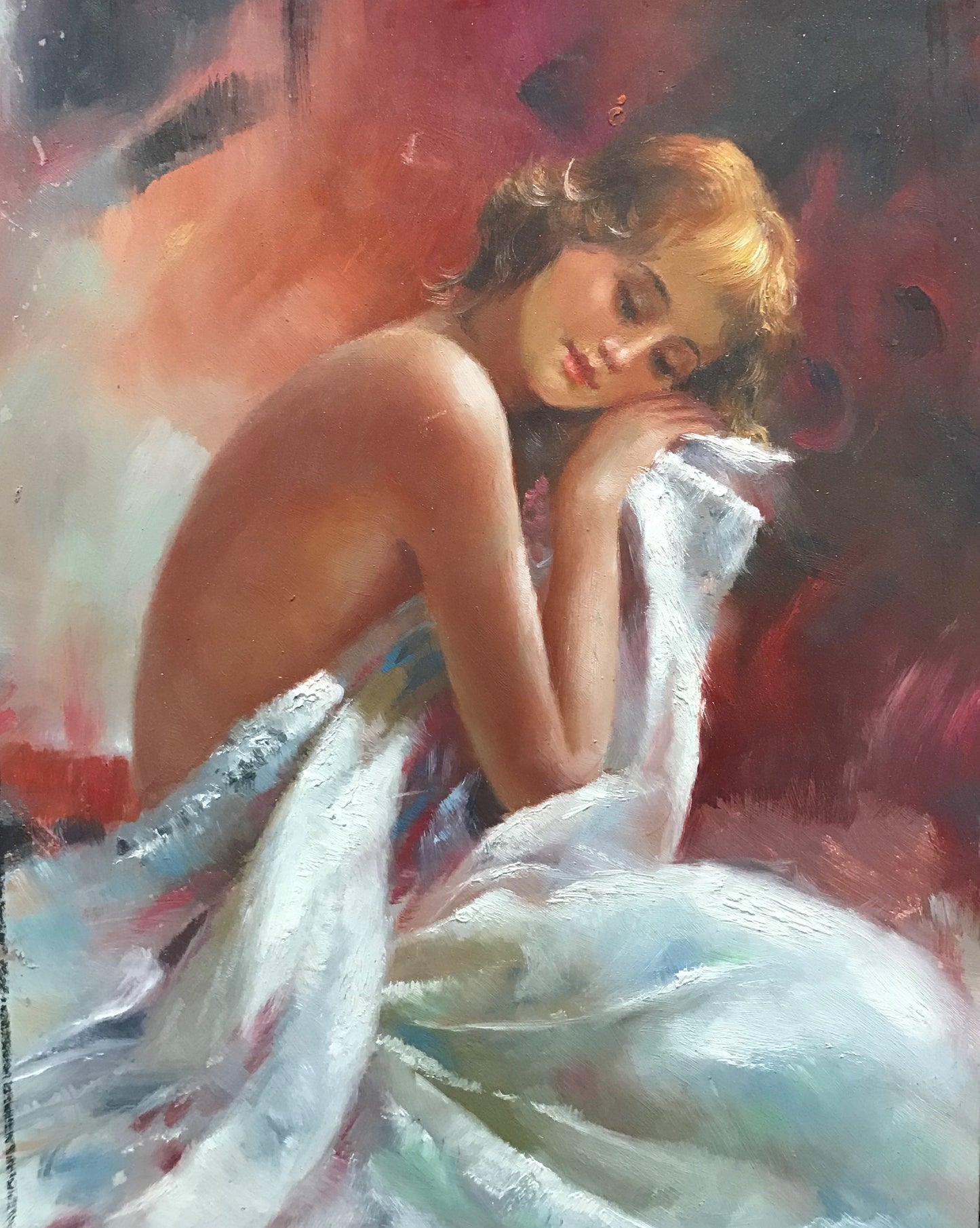 Femme nue dans des draps