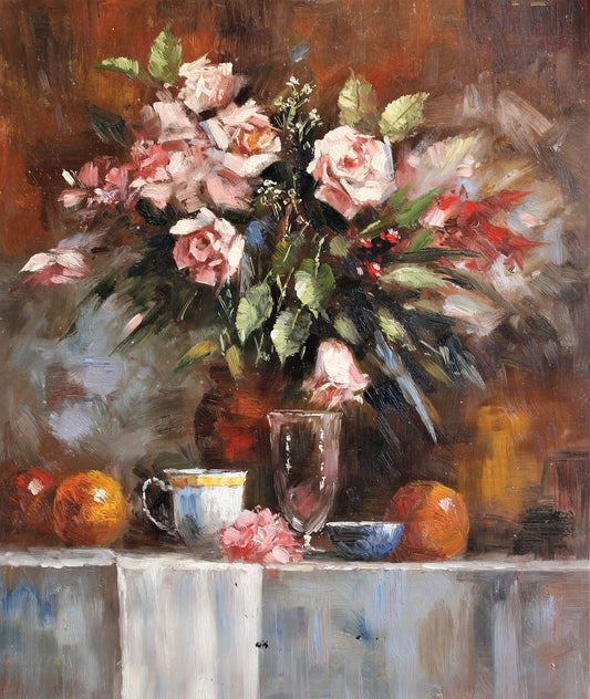 Nature morte de table avec tasse à thé, verres, fruits et fleurs
