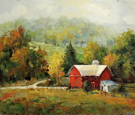 A field and a red farm building