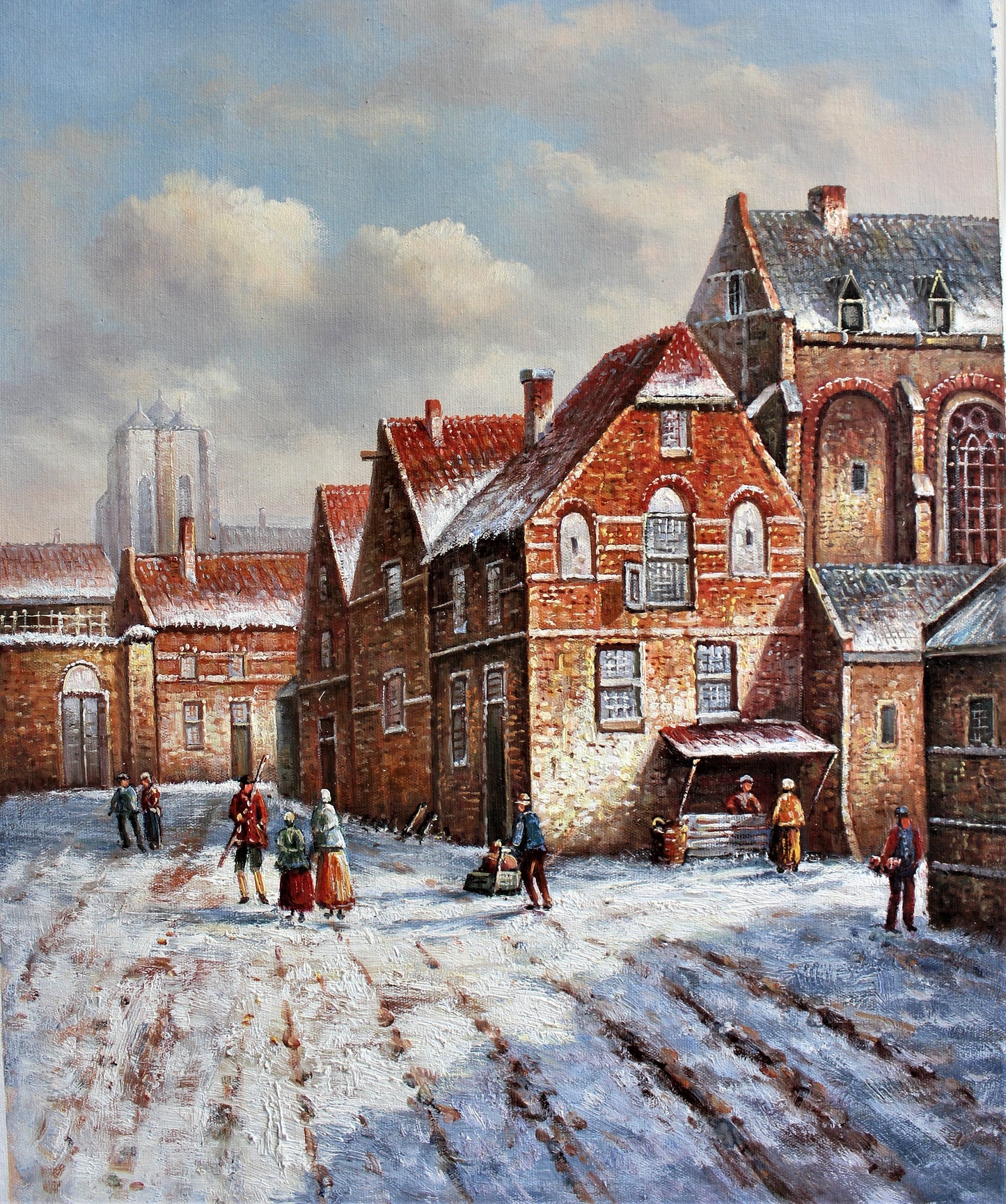 Rue enneigée avec des bâtiments en briques