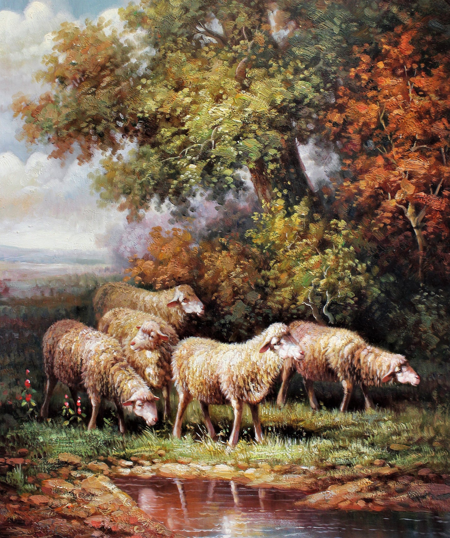 Moutons paissant au bord d'un ruisseau