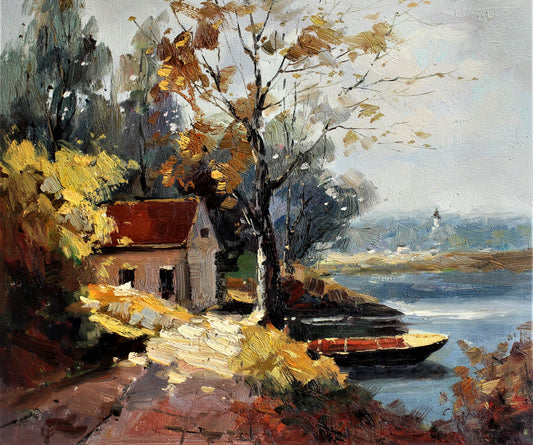 Petit chalet et bateau au bord d'un lac