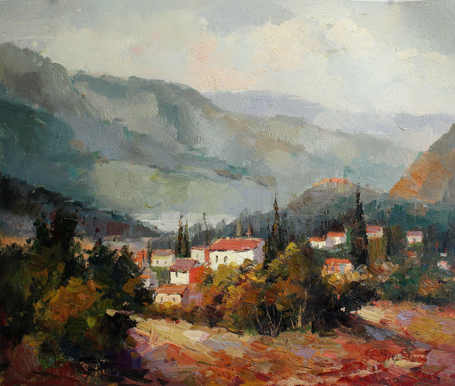 Petit village entouré de montagnes