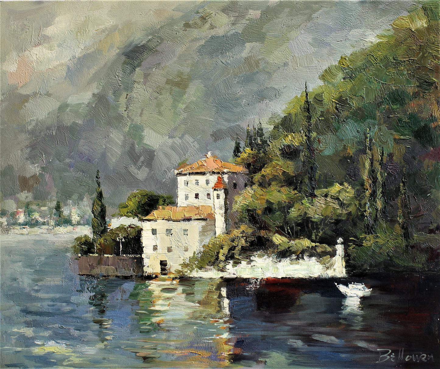 Bâtiment blanc à côté d'une montagne au bord de l'eau