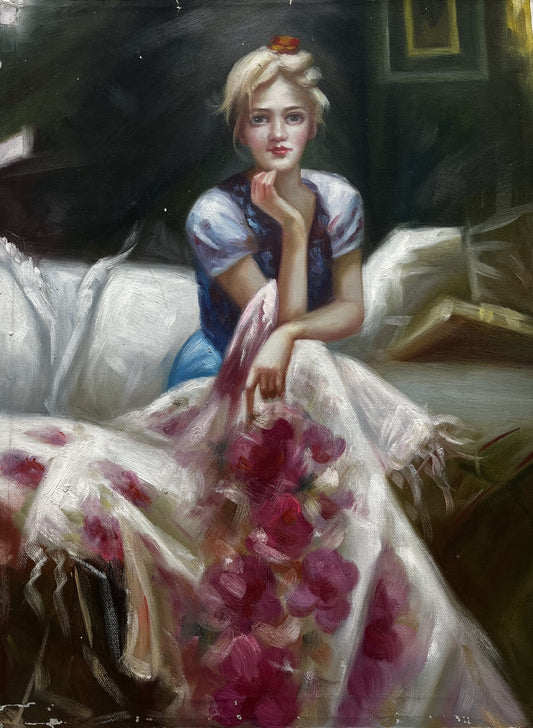 Blonde woman sitting on couch with floral blanket