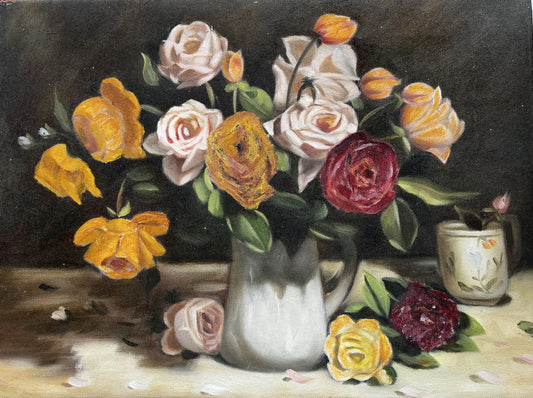 Vase of yellow, pink and red roses
